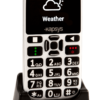 The MiniVision2+ on the charging cradle. The display shows the white weather icon on a black screen.