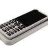 A close-up view of the SmartVision 3 smartphone placed on the wireless charging pad, which is connected to a charging cable.