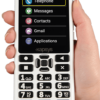 An image of the front view of the SmartVision 3 smartphone being held by a person's hand. The phone screen displays large, easy-to-read icons and text for phone, messaging, people, email, and applications. The time is 6:22 PM on Wednesday, May 18. The device features large, high-contrast buttons with bold numbers and symbols.